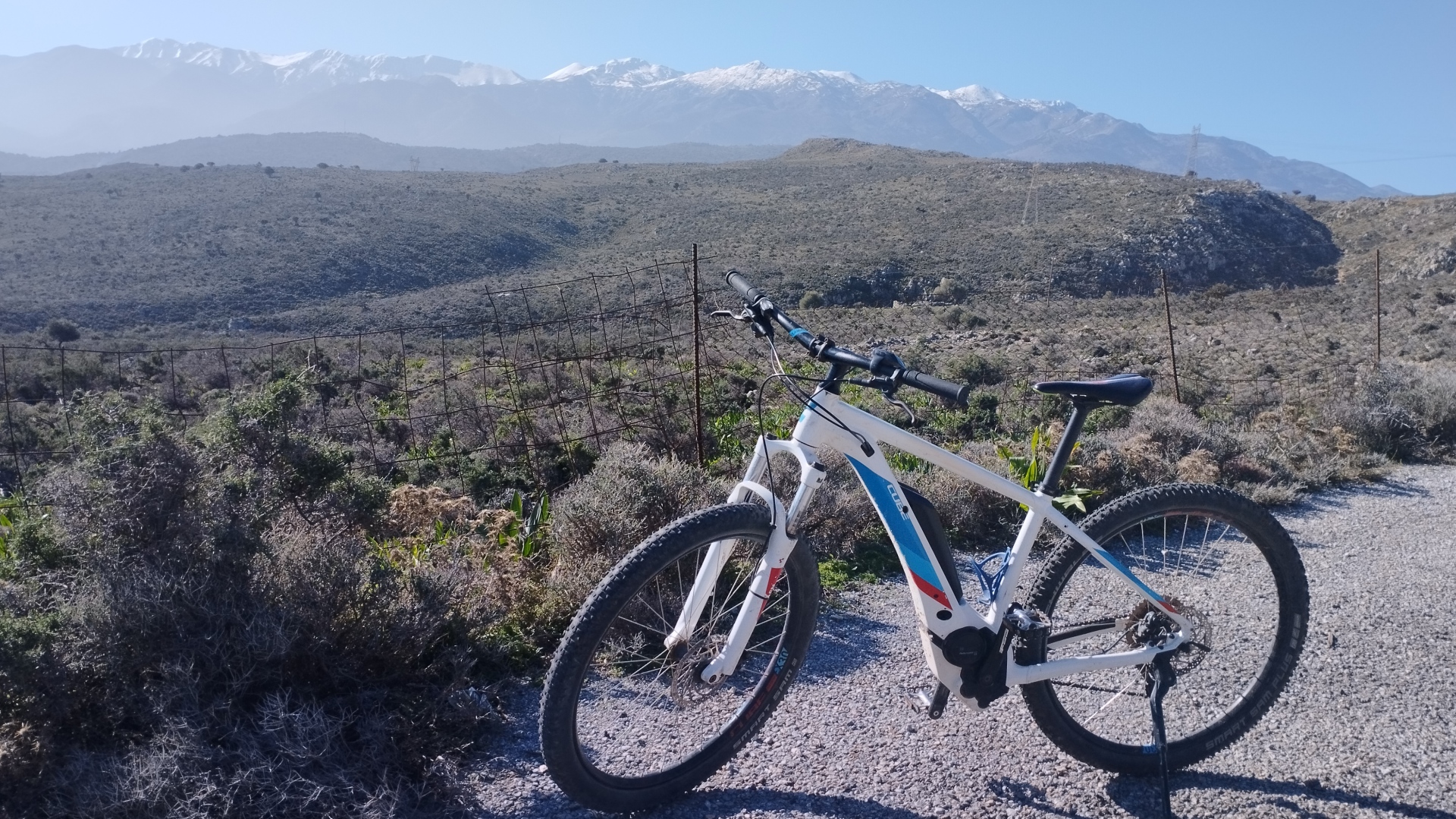 An ebike with the White Mountains of Chania in the background